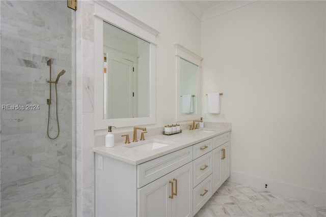 bathroom featuring vanity and tiled shower