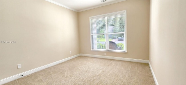 unfurnished room with crown molding and light colored carpet