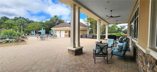 view of patio featuring ceiling fan