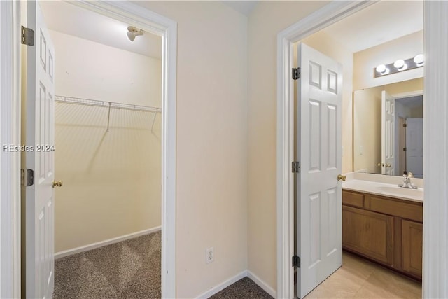 bathroom with vanity and tile patterned floors