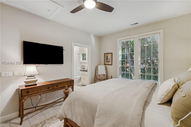 bedroom featuring light tile patterned flooring, ceiling fan, and ensuite bathroom