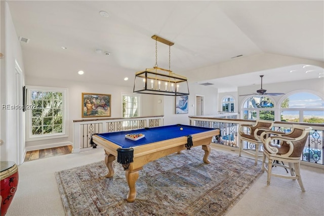 recreation room with lofted ceiling and ceiling fan