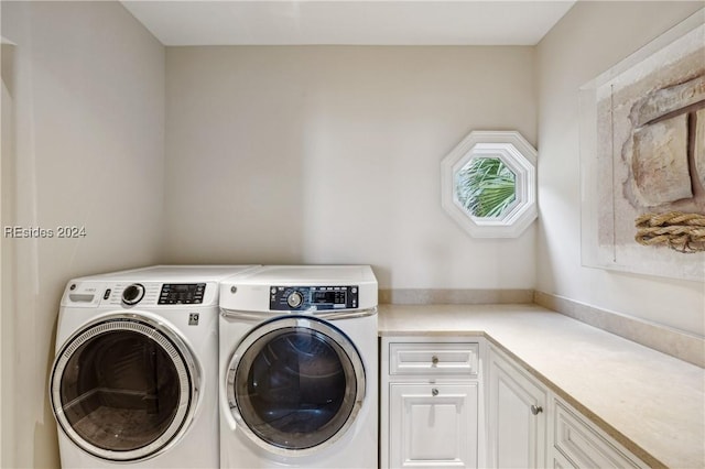 laundry area featuring cabinets and washer and dryer