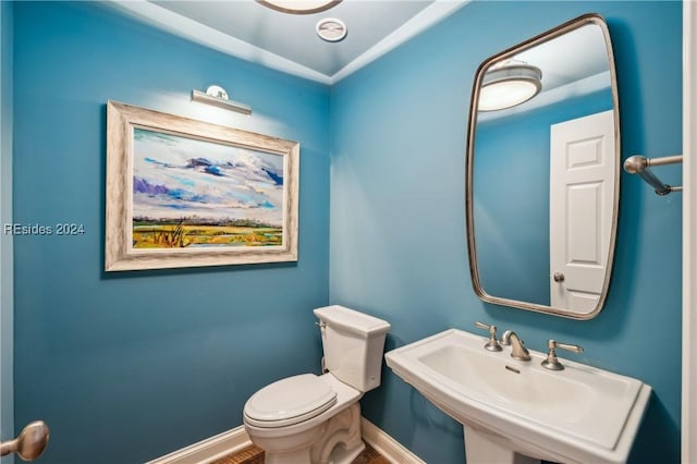 bathroom with sink and toilet