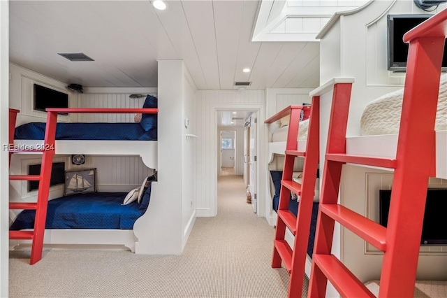 bedroom with crown molding and carpet