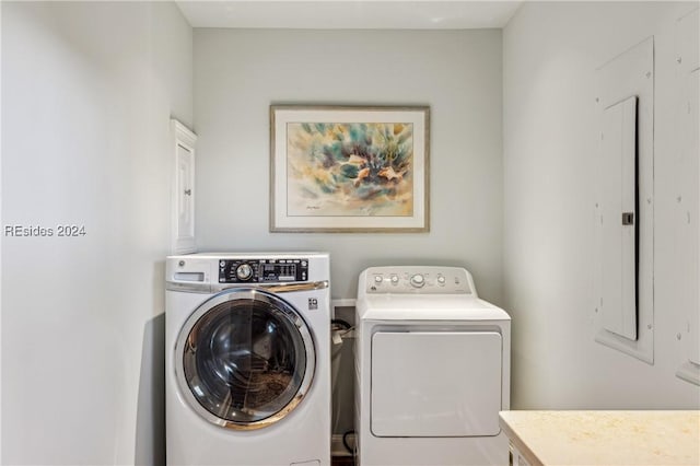 clothes washing area with independent washer and dryer