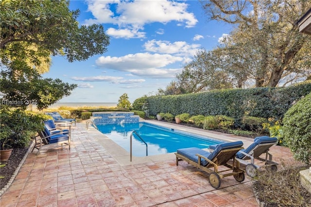 view of swimming pool featuring a patio area