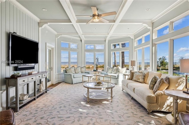 carpeted living room featuring ceiling fan, ornamental molding, coffered ceiling, and beam ceiling