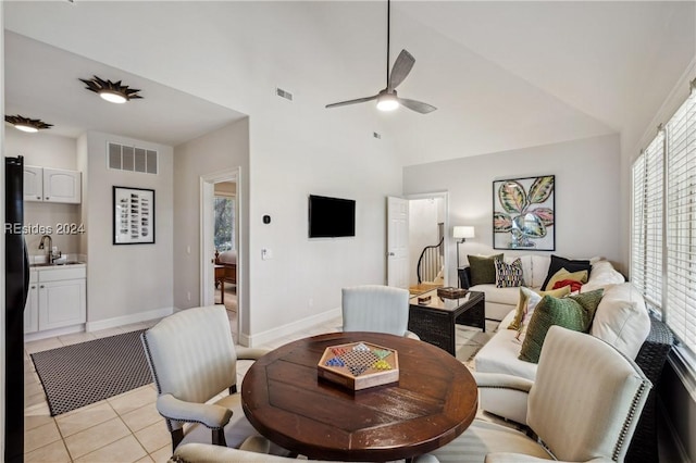 tiled dining room with sink and ceiling fan