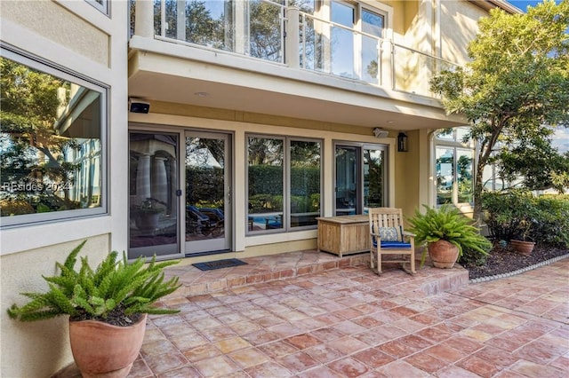 doorway to property with a patio area