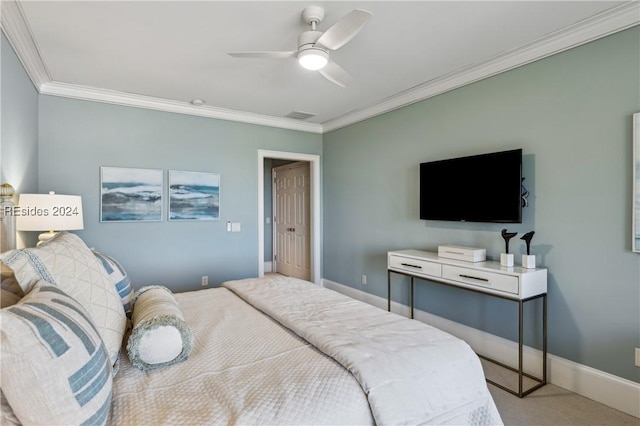 bedroom with ornamental molding, ceiling fan, and carpet