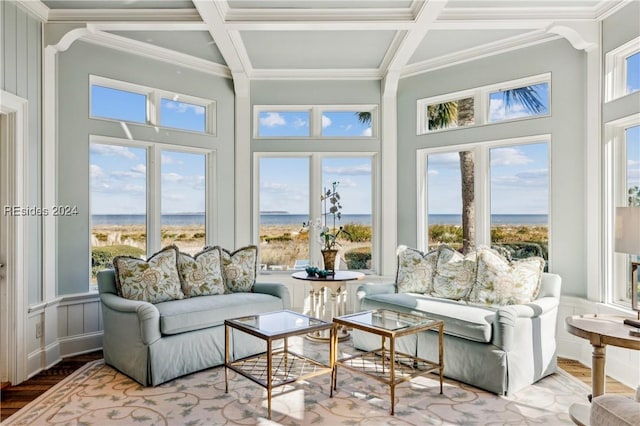 sunroom / solarium with coffered ceiling, a wealth of natural light, and beamed ceiling