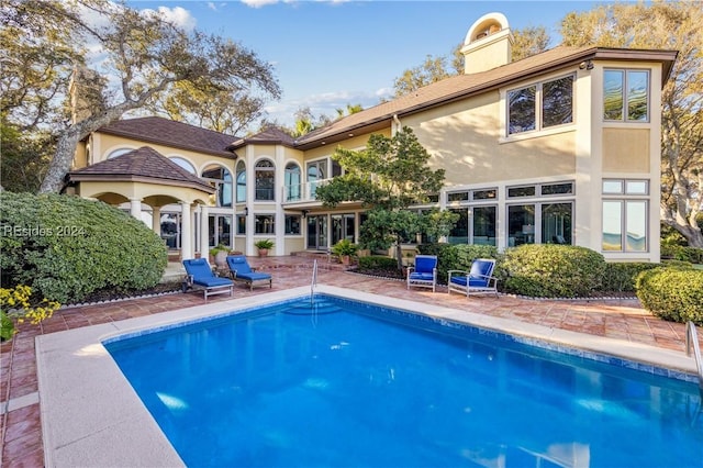 rear view of house with a patio area