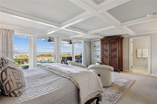 carpeted bedroom with beamed ceiling, ornamental molding, coffered ceiling, access to exterior, and ensuite bath