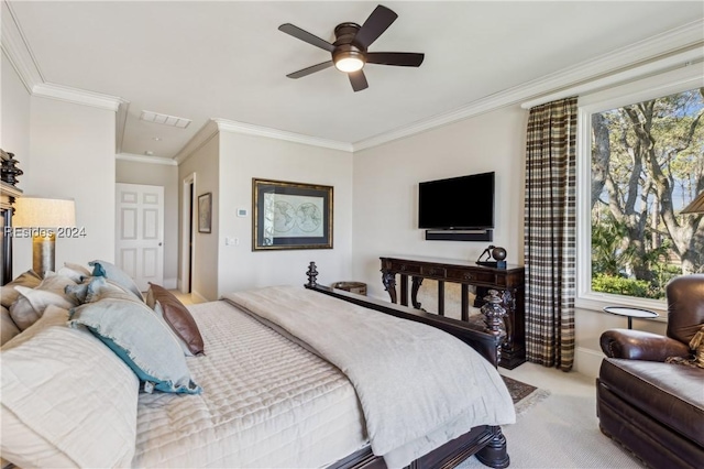 carpeted bedroom with crown molding and ceiling fan