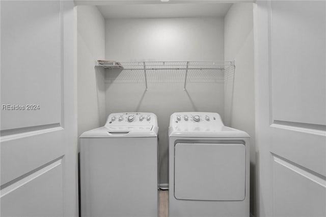 washroom featuring independent washer and dryer