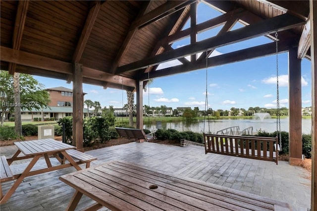 wooden deck with a water view