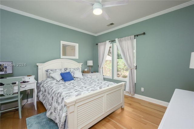 bedroom featuring crown molding, ceiling fan, and light hardwood / wood-style flooring