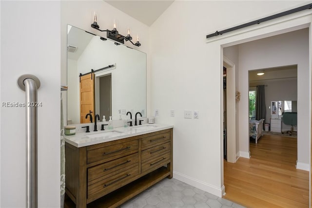 bathroom with vanity and hardwood / wood-style floors