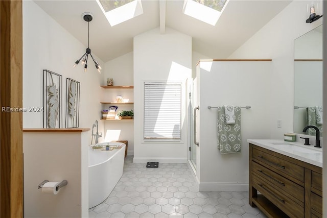 bathroom with vanity, lofted ceiling with skylight, and separate shower and tub