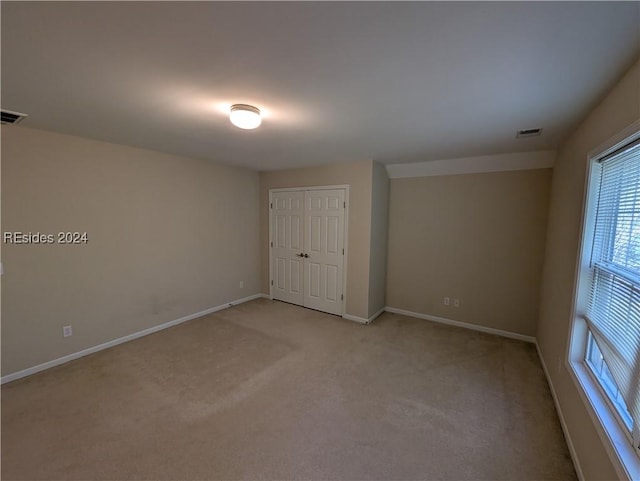 view of carpeted spare room