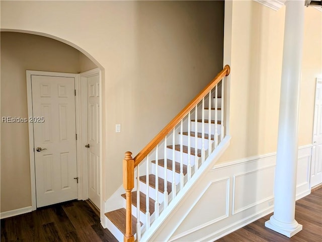 stairs with hardwood / wood-style floors