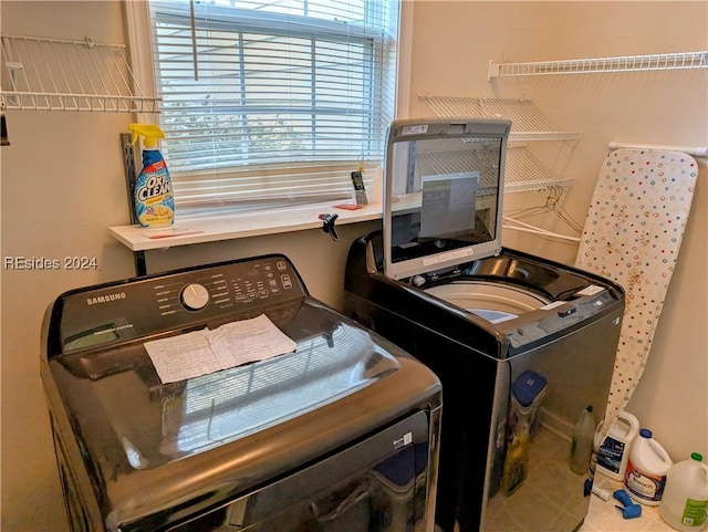 laundry room with separate washer and dryer