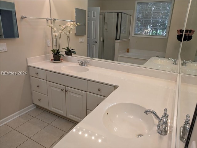 bathroom featuring shower with separate bathtub, tile patterned floors, and vanity