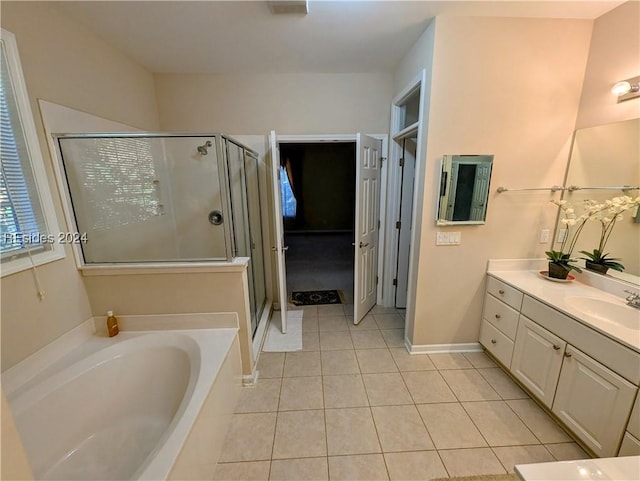 bathroom featuring vanity, separate shower and tub, and tile patterned floors