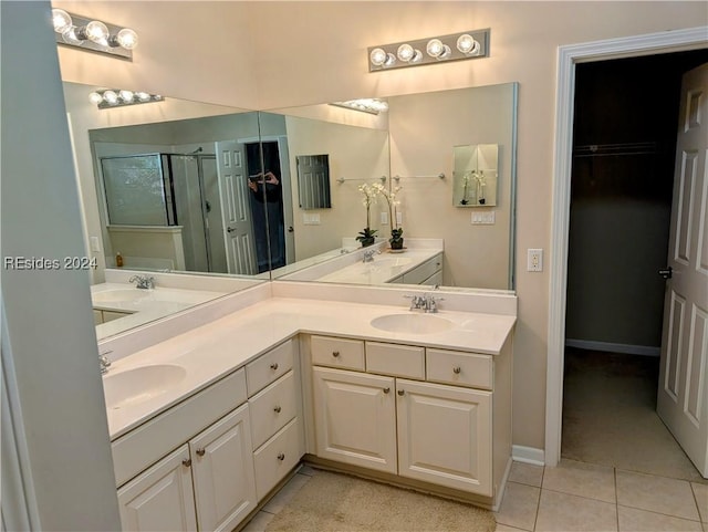 bathroom with vanity, tile patterned floors, and walk in shower