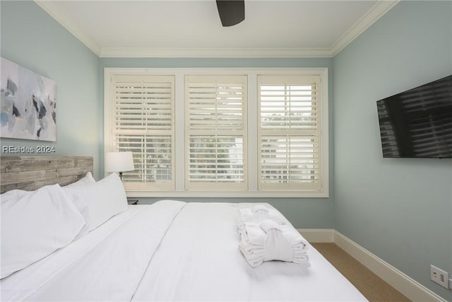 bedroom featuring crown molding, ceiling fan, and carpet