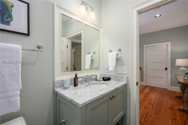 bathroom featuring vanity and wood-type flooring