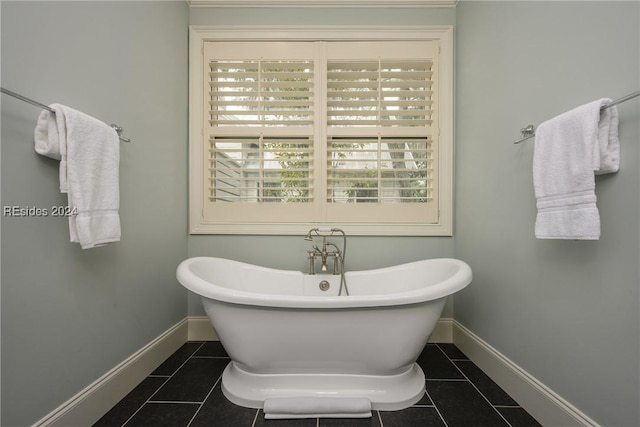 bathroom featuring a washtub and tile patterned floors