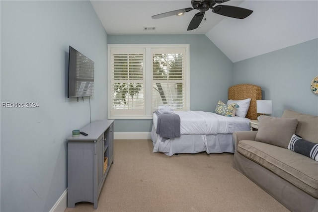 bedroom featuring ceiling fan, lofted ceiling, and light carpet