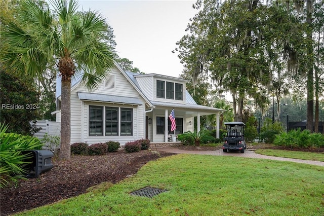 view of front of house with a porch and a front lawn