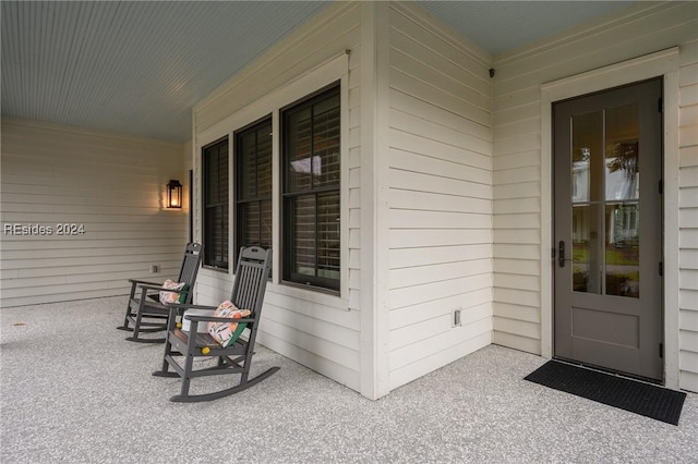 doorway to property featuring a porch