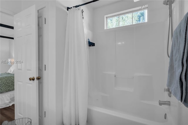 bathroom featuring shower / bath combo with shower curtain