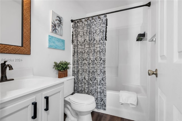 full bathroom featuring shower / bathtub combination with curtain, vanity, toilet, and hardwood / wood-style floors