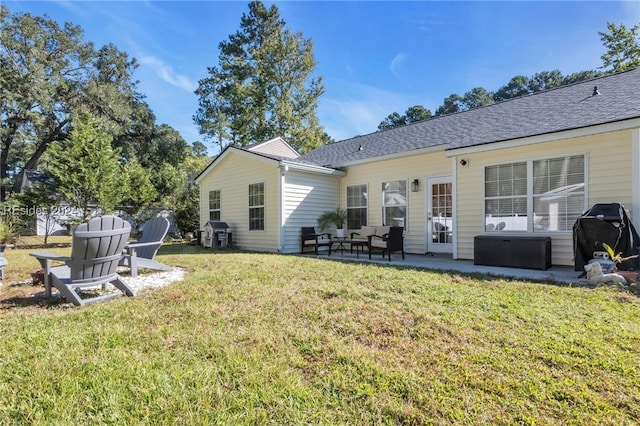 back of property with a patio, outdoor lounge area, and a yard