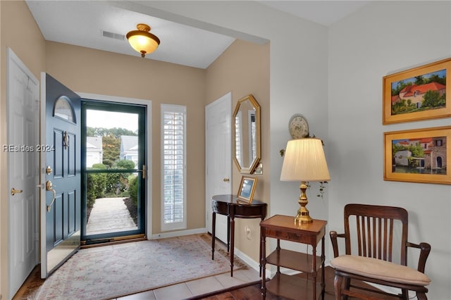 entrance foyer featuring tile patterned flooring