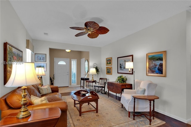 living room featuring hardwood / wood-style flooring and ceiling fan