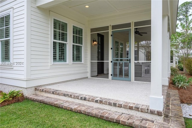 entrance to property featuring ceiling fan