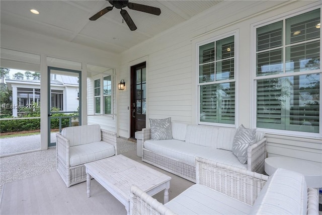 view of patio with ceiling fan and an outdoor living space