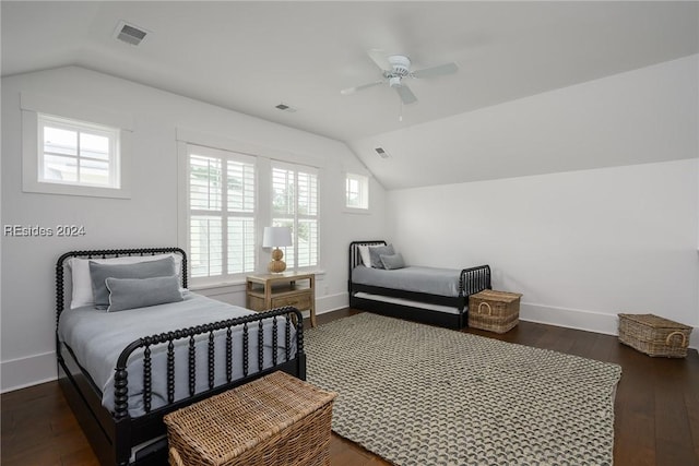 bedroom featuring vaulted ceiling, dark wood-type flooring, and ceiling fan