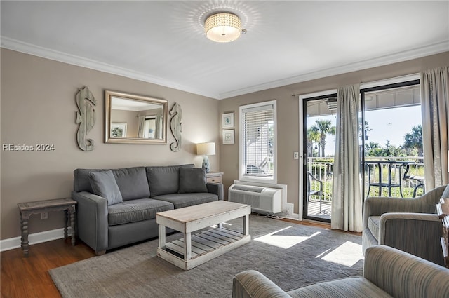 living room with ornamental molding, an AC wall unit, and dark wood-type flooring