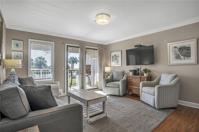 living room featuring ornamental molding and dark hardwood / wood-style floors