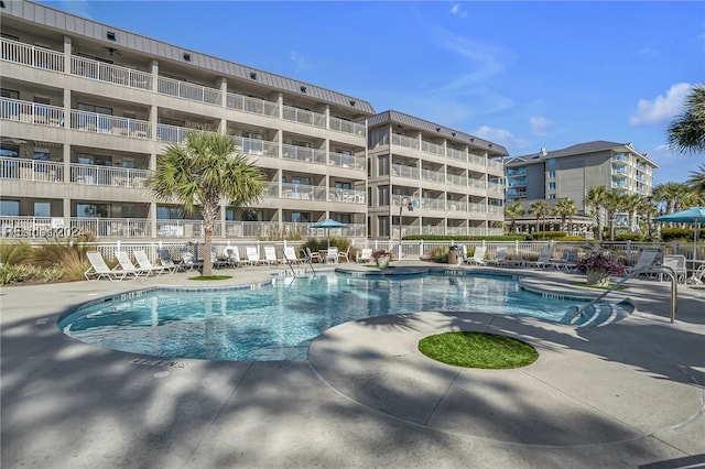 view of swimming pool with a patio