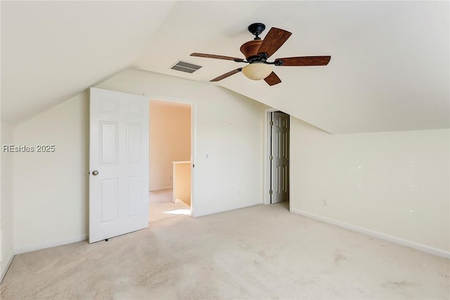 bonus room featuring ceiling fan, vaulted ceiling, and light carpet