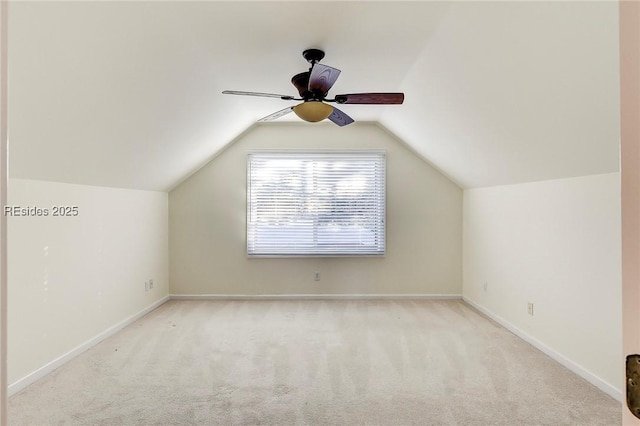 bonus room with ceiling fan, vaulted ceiling, and light carpet