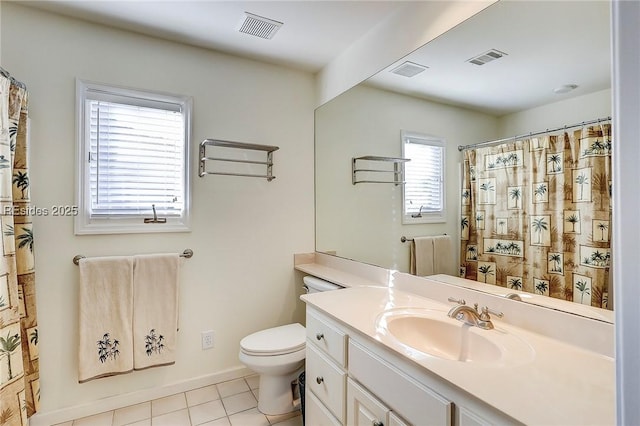 bathroom featuring walk in shower, tile patterned floors, vanity, and toilet